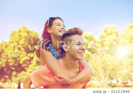 happy teenage couple having fun at summer park 33151940