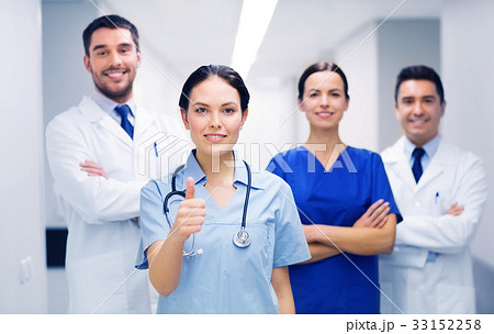 medics or doctors at hospital showing thumbs up 33152258