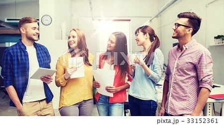 creative team on coffee break talking at office 33152361