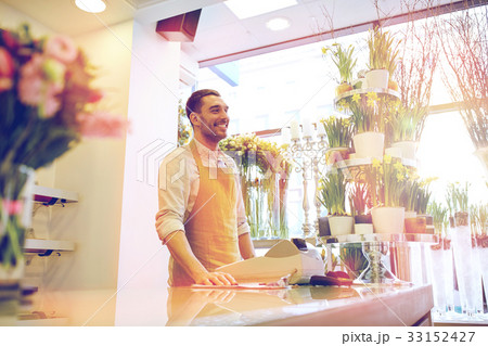 florist man or seller at flower shop counter 33152427