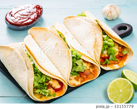 Latin food tacos on blue wooden background Latin food tacos on blue wooden background 33155779