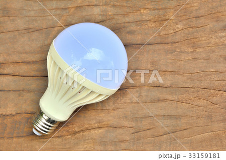 light bulb on brown wooden tabl light bulb on brown wooden tabl 33159181