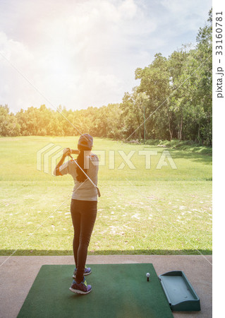 Asian golfer sweeping golf course in the summer Asian golfer sweeping golf course in the summer 33160781