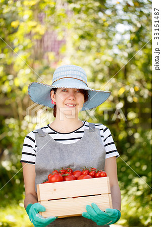 Photo of girl with tomato Photo of girl with tomato 33161487