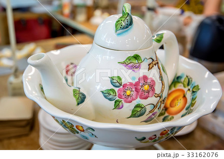 Beautiful delft teapot with flower painting Beautiful delft teapot with flower painting 33162076