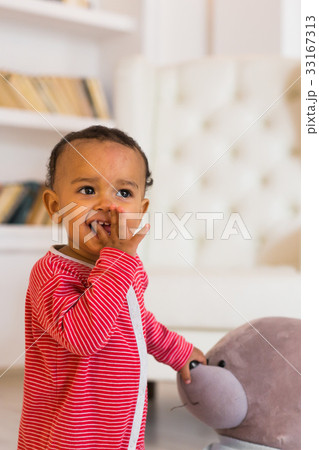 Cute curious baby in the room 33167313