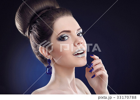 Makeup and manicure. Beauty portrait of young 33170788