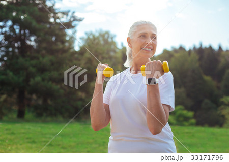 Dreamy woman doing morning exercises Dreamy woman doing morning exercises 33171796