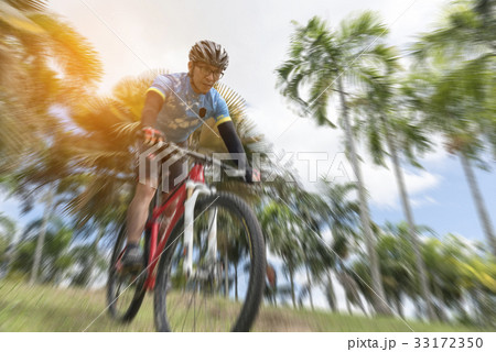 Sportsman cycling bicycle from high, radial blur 33172350