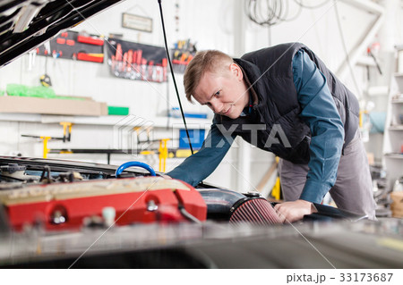 Sports car in a workshop Sports car in a workshop 33173687