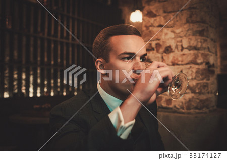 Young gentleman tasting craft beer Young gentleman tasting craft beer 33174127