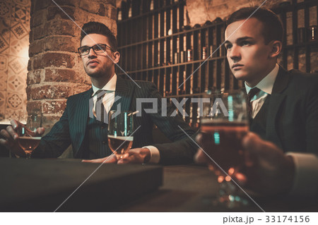 Young gentlemen tasting craft beer 33174156