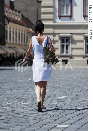 Woman walking on the street 33174593