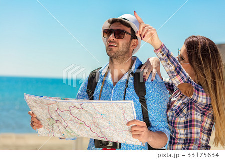Couple tourist traveling and using map. Couple 33175634