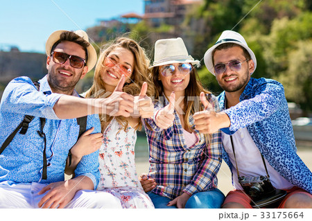 Group of friends taking funny portraits outdoor 33175664