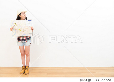 female traveler excitedly looking at copyspace female traveler excitedly looking at copyspace 33177728