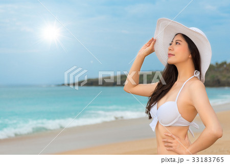 bikini woman wearing white sun hat looking shine 33183765