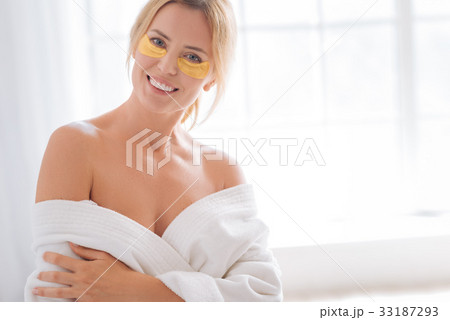 Funny female feeling happiness while doing mask 33187293