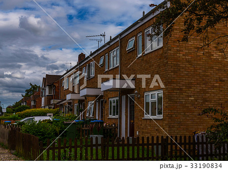 Typical old English buildings, low brick buildings 33190834