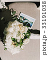 Wedding bouquet lies on the chair with a photo 33191038