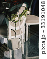 White woman's purse hangs on the back  33191048