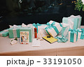 Mint present boxes with white silk bows lie  33191050