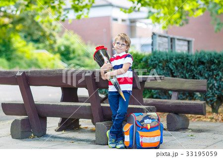 little kid boy with school satchel on first day to little kid boy with school satchel on first day to 33195059