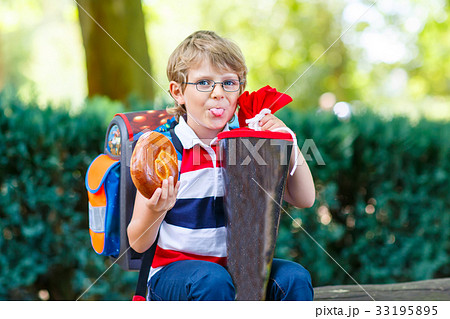 little kid boy with school satchel on first day to little kid boy with school satchel on first day to 33195895