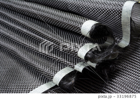 Black carbon fiber composite raw material close up 33196875