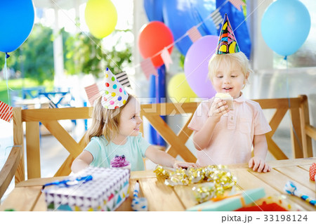 Little boy and girl celebrate birthday party 33198124
