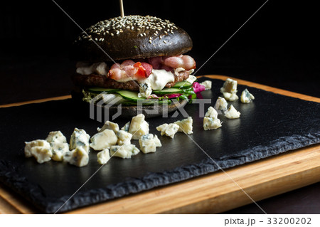 Black hamburger made from beef, with dor-blu. Black hamburger made from beef, with dor-blu. 33200202