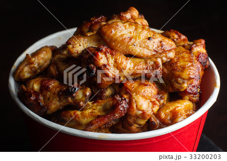 Chicken legs in a bucket. 33200203