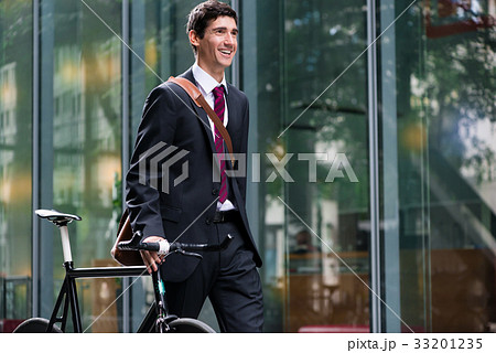 Happy active young man walking to the job after 33201235