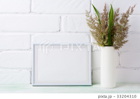 White landscape frame mockup with grass White landscape frame mockup with grass 33204310
