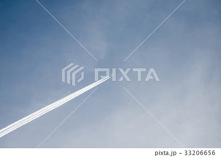 Aircraft in cloudy sky with trail Aircraft in cloudy sky with trail 33206656