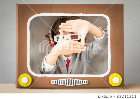 Child playing with cartoon TV Child playing with cartoon TV 33211311