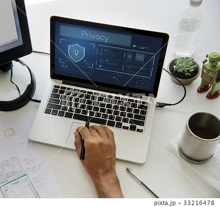 Hands working on laptop network graphic overlay 33216478