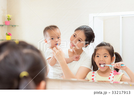 smiling elegance mom holding little baby son 33217913