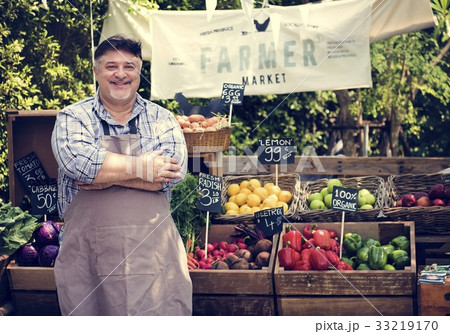 Greengrocer selling organic fresh agricultural product at farmer 33219170