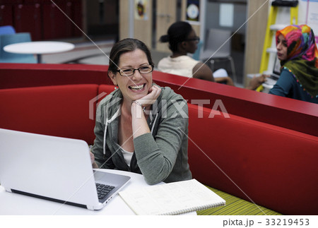 Woman working on laptop networking technology Woman working on laptop networking technology 33219453