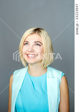 Girl at empty gray background 33223647