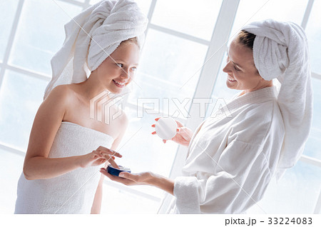 Joyful girl listening her mother 33224083