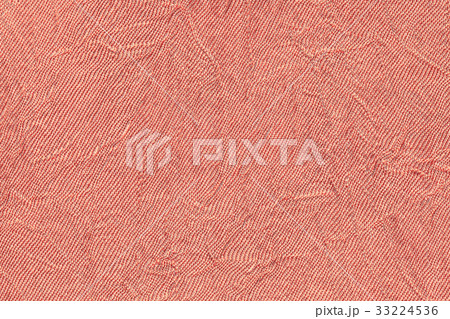 Light red wavy background from a textile material. Light red wavy background from a textile material. 33224536
