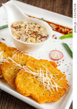 Potato pancake with sauce Potato pancake with sauce 33229238