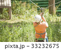 Boy climbs a tree 33232675
