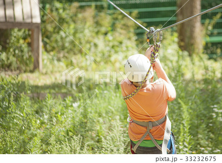 Boy climbs a tree 33232675