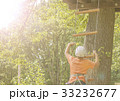 Boy climbs a tree 33232677