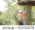 Boy climbs a tree 33232678