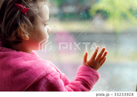 Close up of a Little cute girl in pink bathrobe Close up of a Little cute girl in pink bathrobe 33233928