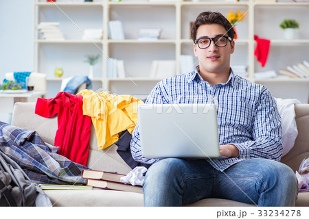 Young man working studying in messy room 33234278